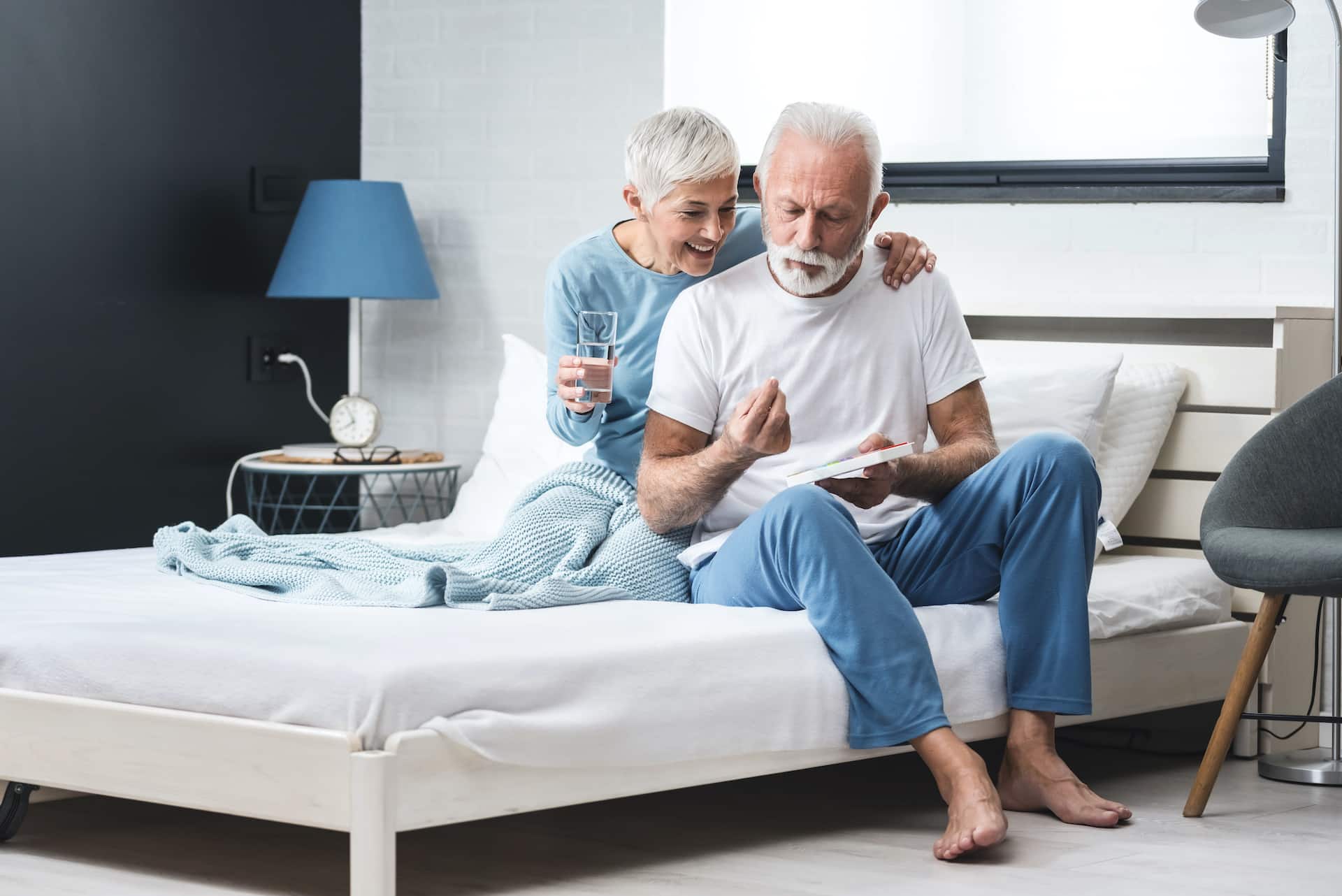 Elderly couple taking medication